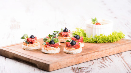 Delicious canapes with salami