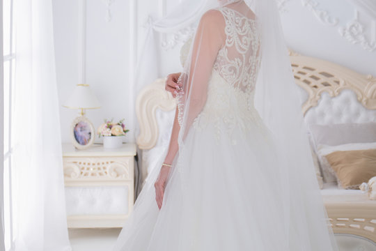 bride in a wedding dress in a bright room