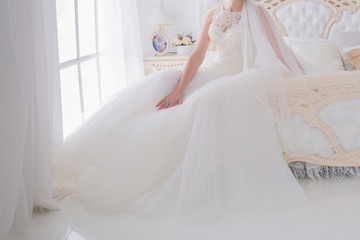bride in a wedding dress in a bright room
