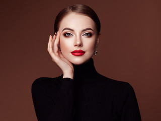 Beautiful Young Woman with Clean Fresh Skin. Perfect Makeup. Beauty Fashion. Red Lips. Cosmetic...