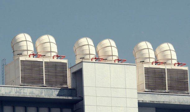 big ventilation chimney on building roof, Ventilation System on the Building Roof. Rainy Weather. Industrial Air system of ventilation and Air conditioning. Aerial Shot.