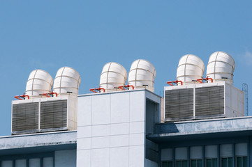 big ventilation chimney on building roof, Ventilation System on the Building Roof. Rainy Weather. Industrial Air system of ventilation and Air conditioning. Aerial Shot.