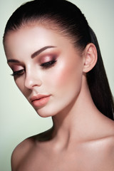 Naklejka premium Beautiful Young Woman with Clean Fresh Skin. Perfect Makeup. Beauty Fashion. Eyelashes. Cosmetic Eyeshadow. Highlighting. Cosmetology, Beauty and Spa
