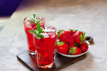 Fresh strawberry lemonade garnished with mint, copy space