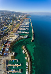 Amazing drone shots above the french lake side town of Evian Les Bains in France. The town is famous for its thermal Spas and mineral Water.