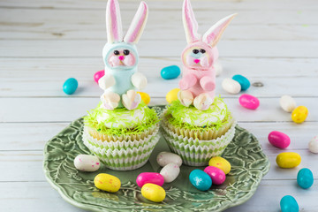 Capcakes with rainbow marshmallow bunnies.