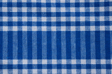 Blue tablecloth, gingham pattern, texture. Textile, checked abstract retro picnic fabric...
