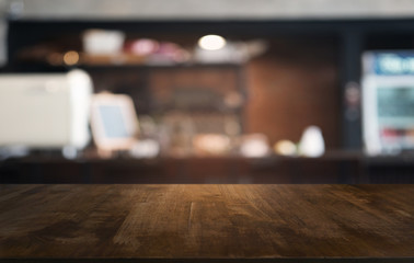 Empty dark wooden table in front of abstract blurred bokeh background of restaurant . can be used for display or montage your products.Mock up for space.