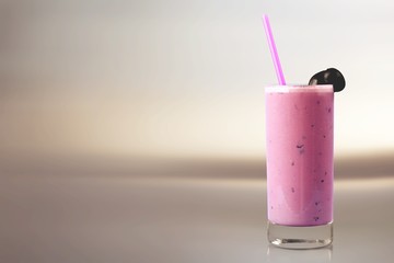 Glass of delicious berry cocktail on perple background