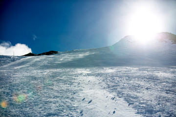 Happy people, children and adults, skiing on a sunny day in Tyrol mountains