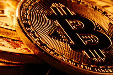 Fototapeta na wymiar Physical symbol cryptocurrency. Golden bitcoins closeup. Digital currency