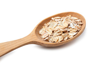 Spoon with oat flakes on white background