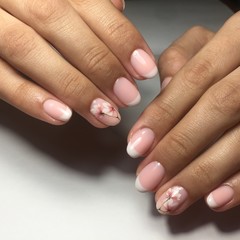 Flesh-colored manicure on nails. Female manicure