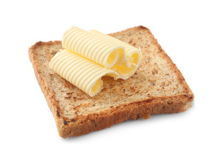 Tasty toasted bread with butter curls on white background