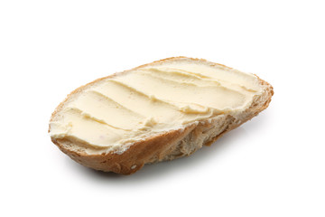 Slice of bread with butter on white background