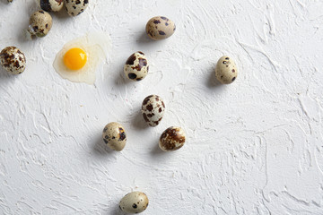 Fresh raw quail eggs on white table