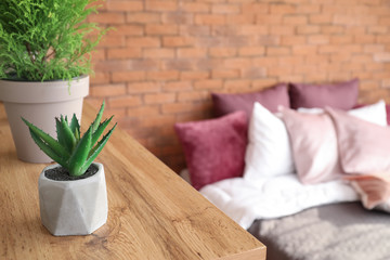 Floral decor on shelf in modern bedroom