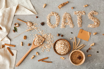 Composition with raw oatmeal on grey background
