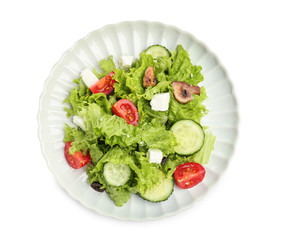 Plate with tasty fresh salad on white background