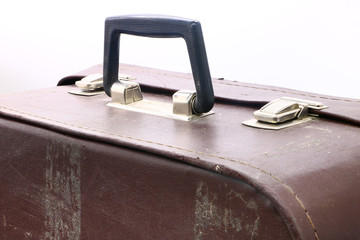 old and battered suitcase on white background