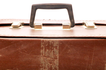 old and battered suitcase on white background
