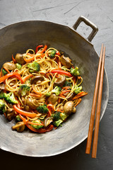 Udon stir-fry noodles with vegetables in wok