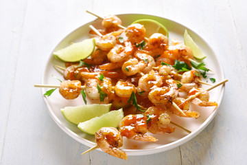 Prawns skewers with sauce