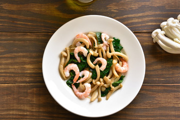 White beech mushrooms with leaves of spinach and shrimps