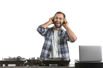 Male DJ playing music on white background