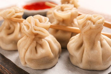 Eating of tasty dumplings, closeup