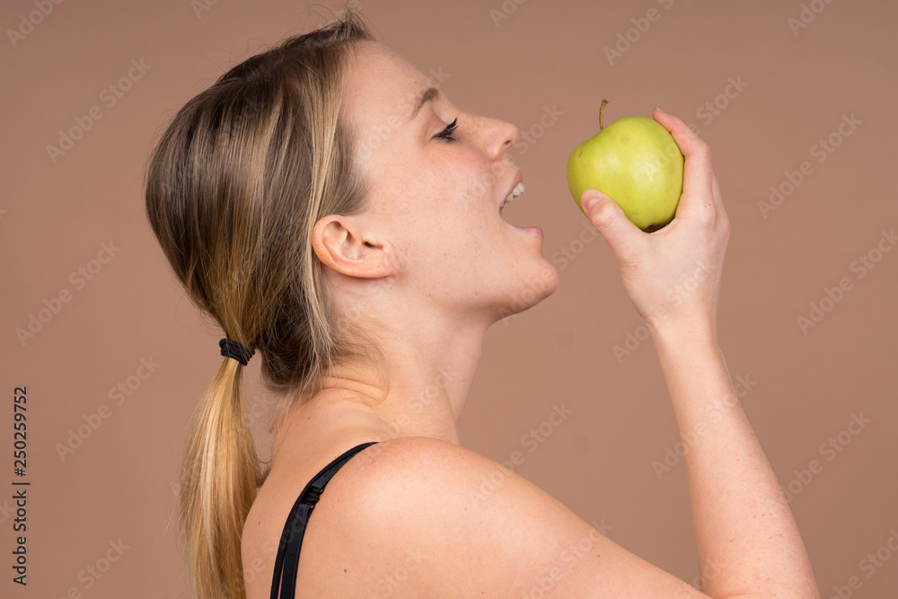 Wall mural girl with an apple