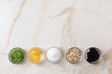 Natural ingredients for cosmetic on light background