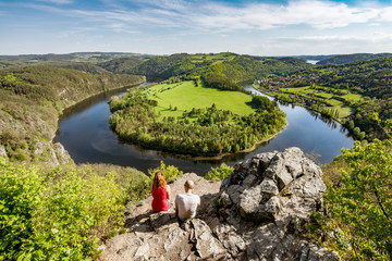 Couple enjoying view on horseshoe landscape scenery.