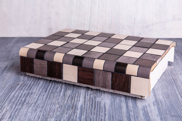 Sample of an exhibition angular tile of black-and-white color