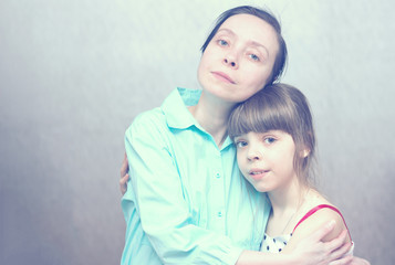 The love of mothers and daughters.  Mother and daughter in each other's arms.