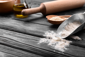 Kitchenware and ingredients for making bread on table