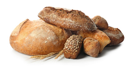 Loaves of fresh bread on white background