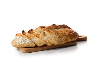 Board with cut loaf of fresh bread on white background