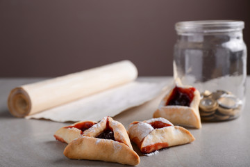 Tasty hamantaschen for Purim holiday on table