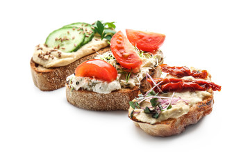 Fresh tasty bruschettas on white background