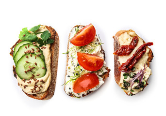 Fresh tasty bruschettas on white background