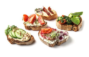 Fresh tasty bruschettas on white background