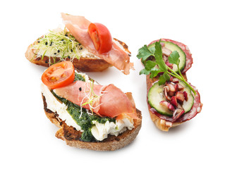 Fresh tasty bruschettas on white background