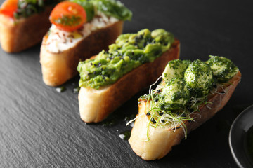 Fresh tasty bruschettas on dark background