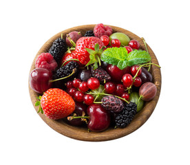 Top view. Fruits and berries in bowl on white background. Background of mix fruits with copy space for text. Mix berries isolated on a white background. Various fresh summer.