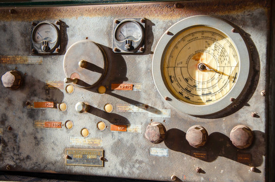 An old Radio  with shadows indicating all the knobs