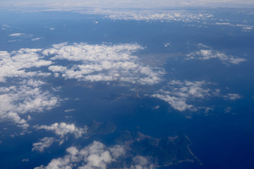 Naklejka na ściany i meble an Aerial view of plane window looking down to land