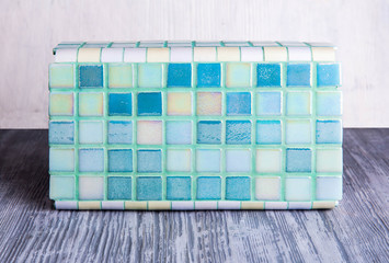 Sample of a tile of color of a sea wave for bathrooms and kitchen