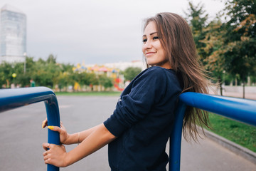 Amazing sport and beauty girl posing at the park