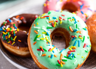 Front view of a group of sweet donuts, close up